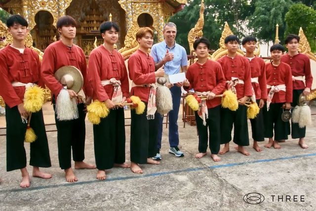 dr dan gubler chief scientific officer standing with a group of boys at the temple in thailand to honor three